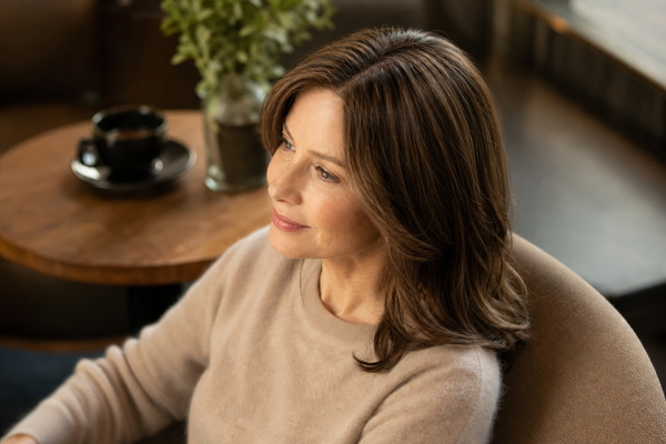 close-up of a comfortably blended hair topper with a natural parting