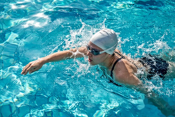 swim cap protecting hair topper at pool