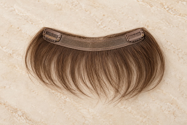 lightweight low-profile hairline extension piece displayed in a premium salon setting